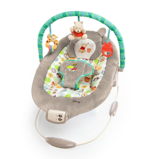 Bright Starts Disney Baby Winnie the Pooh Baby Bouncer Soothing Vibrations Deluxe Infant Seat - Faux Suede, Music, Removable -Toy Bar, 0-6 Months 6-20 lbs (Dots & Hunny Pots)